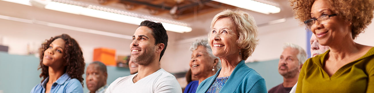 Chiropractic community outreach Photo, people sitting in a room looking to a presenter.